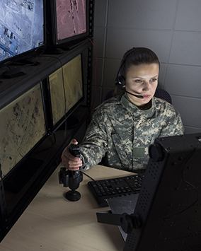 U.S. army female controlling a joystick